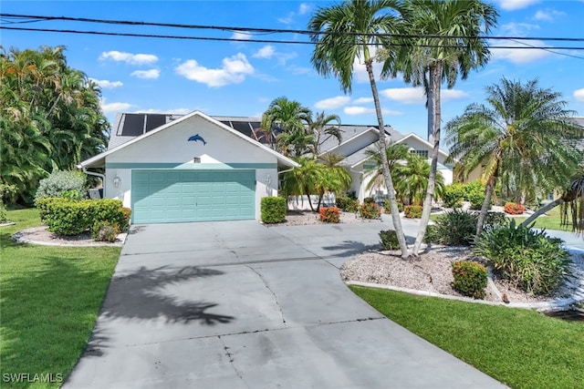 view of front facade featuring a garage and a front lawn