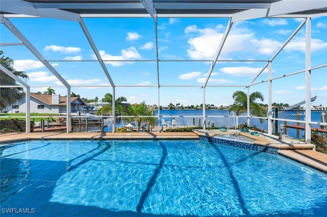 view of swimming pool featuring a lanai, a water view, and a patio area