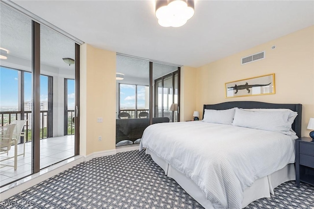 8171 Bay Colony Dr Unit 2004, Naples, FL 34108 - bedroom featuring access to outside and carpet