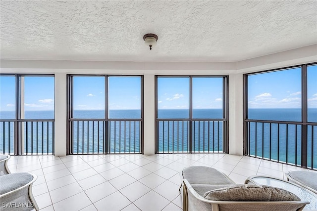 8171 Bay Colony Dr Unit 2004, Naples, FL 34108 - sunroom featuring a water view