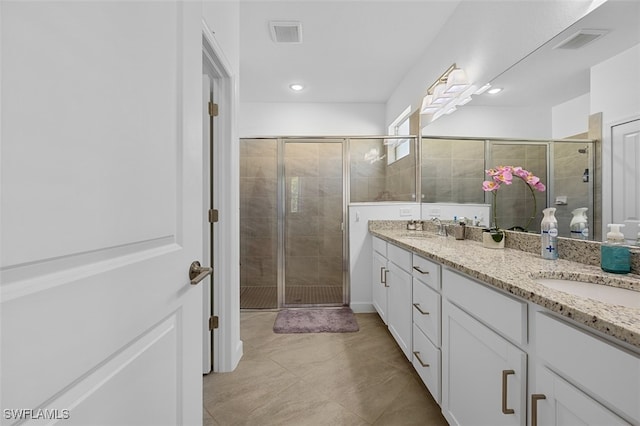 bathroom with vanity and an enclosed shower