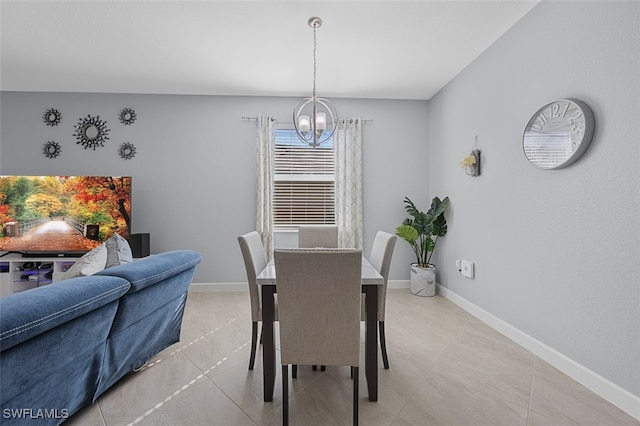 tiled dining area featuring a notable chandelier