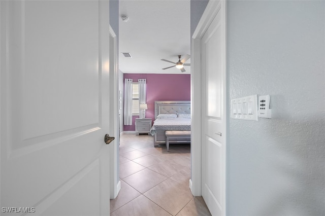 corridor with light tile patterned floors