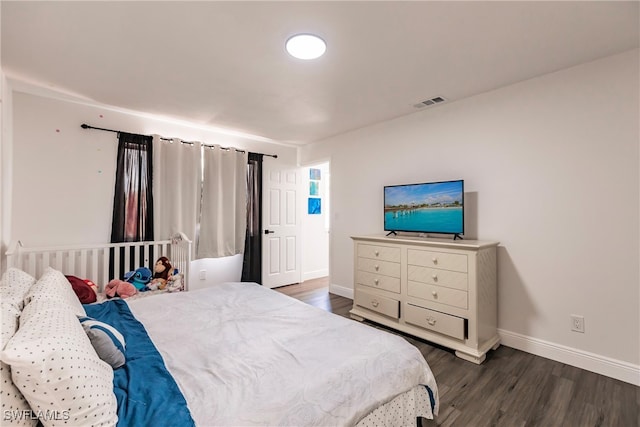 bedroom featuring dark hardwood / wood-style floors