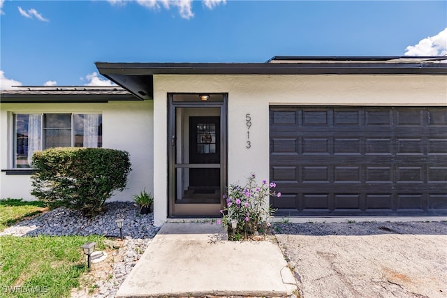 entrance to property featuring a garage