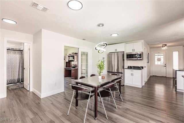 dining area with light wood-type flooring