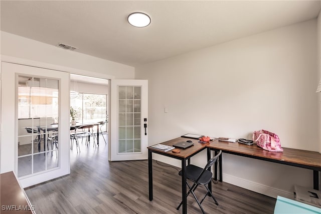 home office with french doors and dark hardwood / wood-style floors