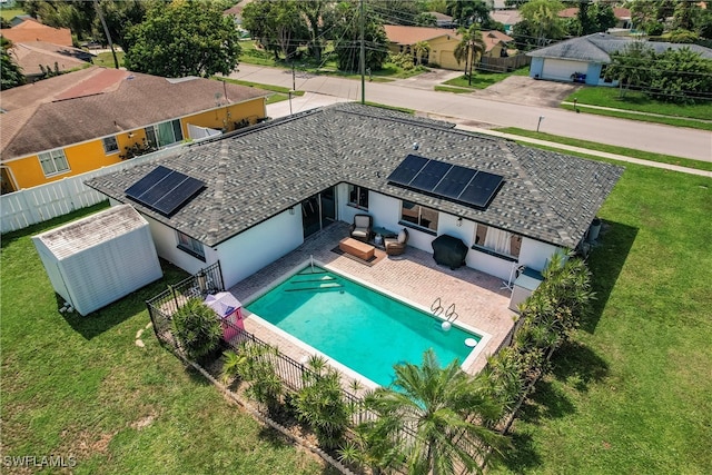 view of swimming pool featuring a patio, a lawn, and an outdoor living space