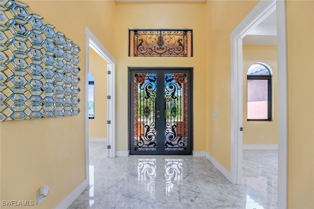 foyer entrance featuring french doors