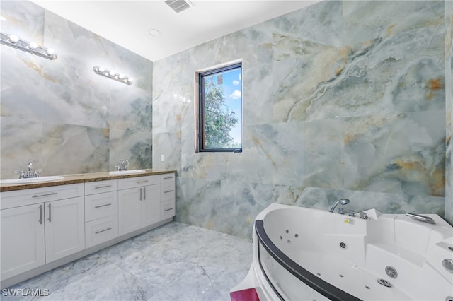 bathroom with tile walls, vanity, and a washtub