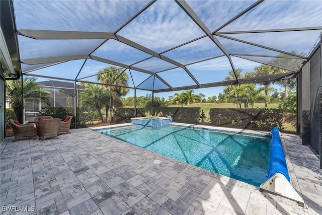 view of pool featuring a pool with connected hot tub, glass enclosure, and a patio