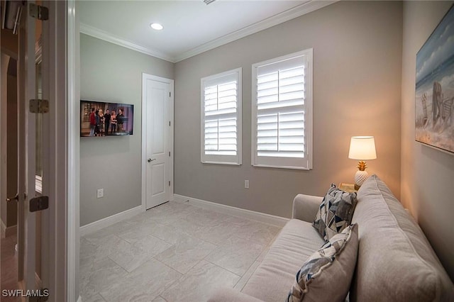 sitting room with baseboards, recessed lighting, and crown molding