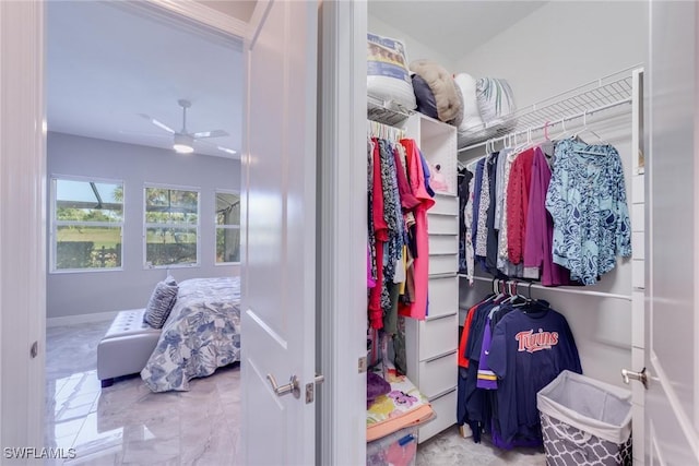 spacious closet featuring a ceiling fan