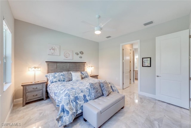 bedroom with marble finish floor, visible vents, connected bathroom, and baseboards