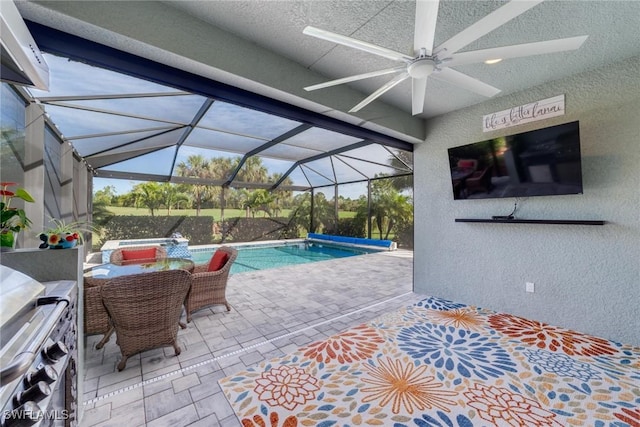 outdoor pool featuring glass enclosure and a patio area