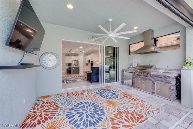 kitchen featuring ceiling fan, recessed lighting, light countertops, fridge, and island exhaust hood