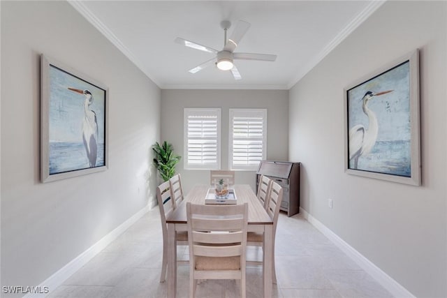 dining space featuring light tile patterned floors, ornamental molding, a ceiling fan, and baseboards