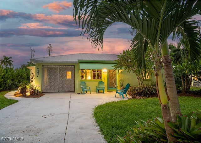 view of front of home with a lawn