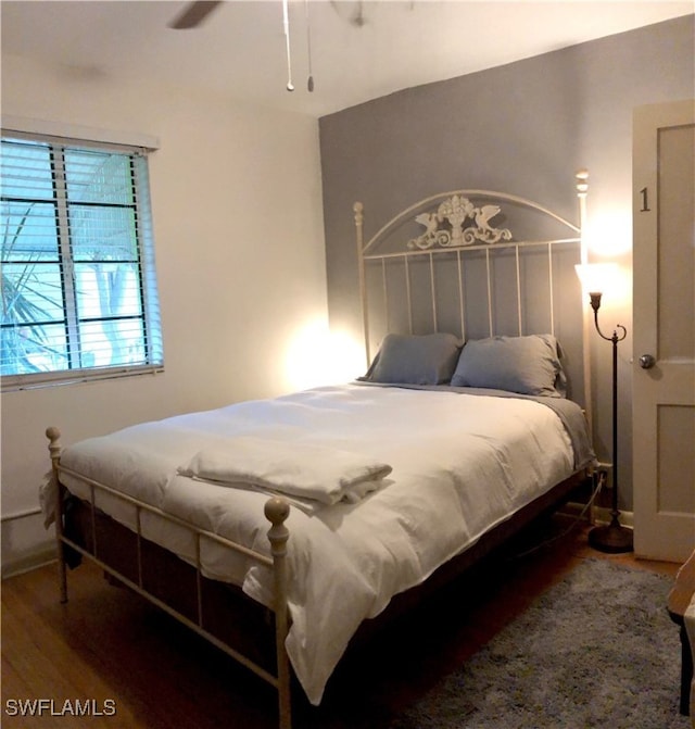 bedroom featuring hardwood / wood-style flooring