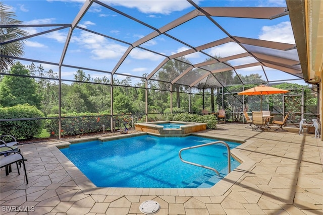 view of swimming pool featuring glass enclosure, an in ground hot tub, and a patio