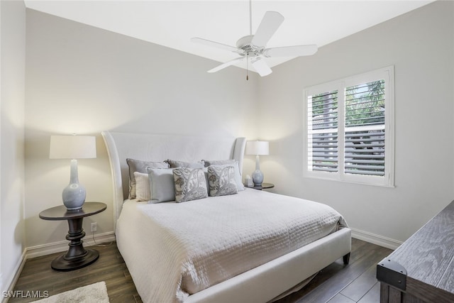 bedroom with ceiling fan and dark hardwood / wood-style floors