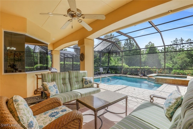 view of swimming pool with an in ground hot tub, outdoor lounge area, ceiling fan, glass enclosure, and a patio area