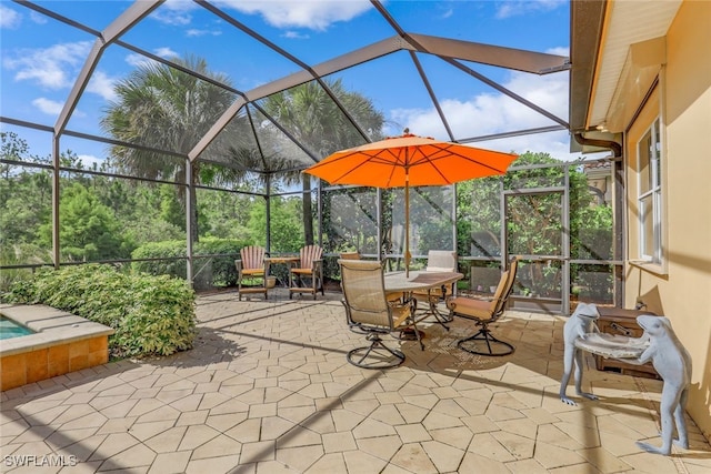 view of patio with glass enclosure