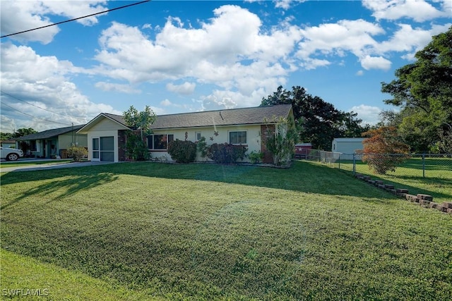 ranch-style house featuring a front lawn