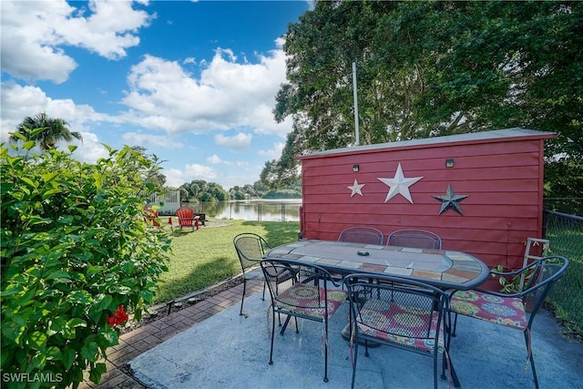 view of patio featuring a water view