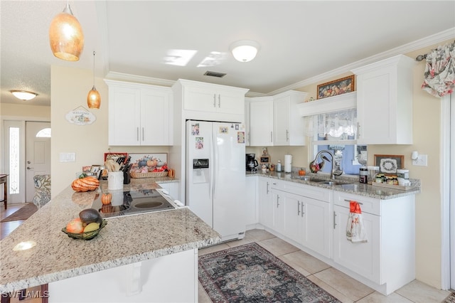 kitchen featuring white fridge with ice dispenser, decorative light fixtures, sink, ornamental molding, and white cabinets