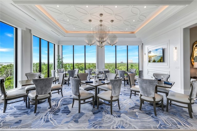 sunroom featuring a notable chandelier