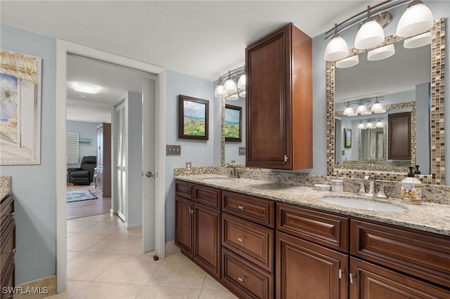 bathroom with tile patterned flooring and vanity