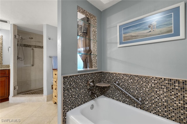 bathroom featuring separate shower and tub, tile patterned flooring, and vanity