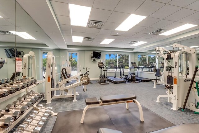 exercise room featuring a paneled ceiling