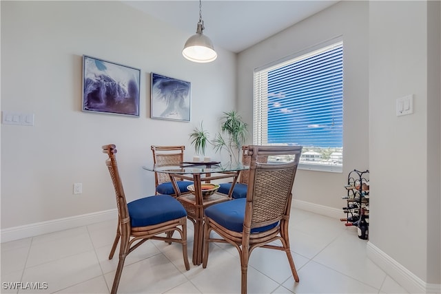 dining area featuring light tile patterned flooring and a wealth of natural light