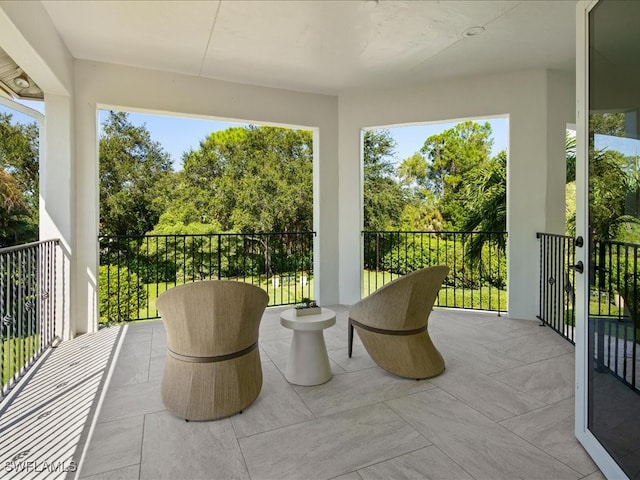 view of patio featuring a balcony