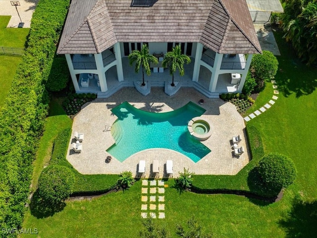 view of swimming pool with a lawn and a patio area