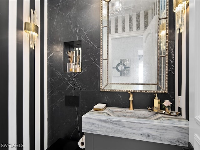 bathroom featuring tile walls and vanity