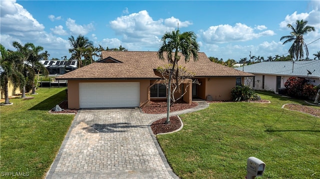 ranch-style house with a front lawn and a garage