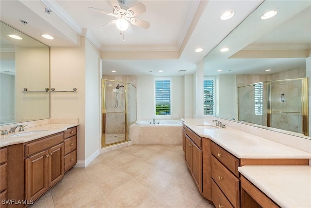 bathroom featuring ceiling fan, vanity, crown molding, and plus walk in shower