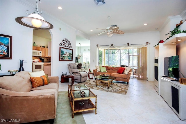 living room featuring ornamental molding, ceiling fan, and light tile patterned floors