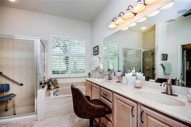 bathroom featuring shower with separate bathtub, tile patterned flooring, and vanity