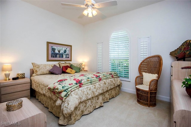 bedroom featuring ceiling fan and light colored carpet