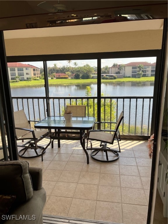 balcony featuring a water view