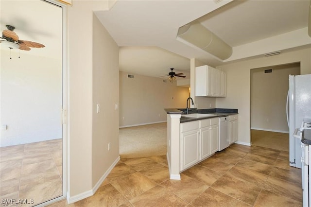 kitchen with white cabinets, dishwasher, ceiling fan, and sink