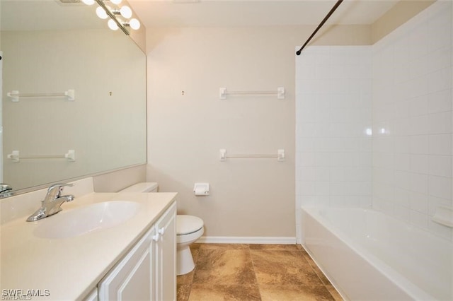 full bathroom featuring tub / shower combination, vanity, and toilet