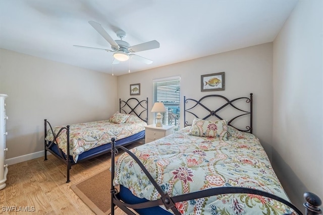 bedroom featuring light hardwood / wood-style floors and ceiling fan