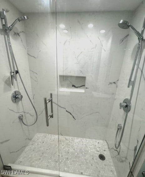 bathroom with a shower with shower door