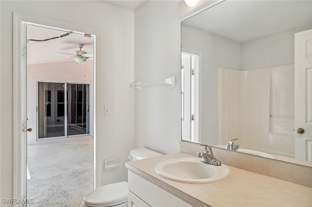 bathroom featuring ceiling fan, vanity, and toilet