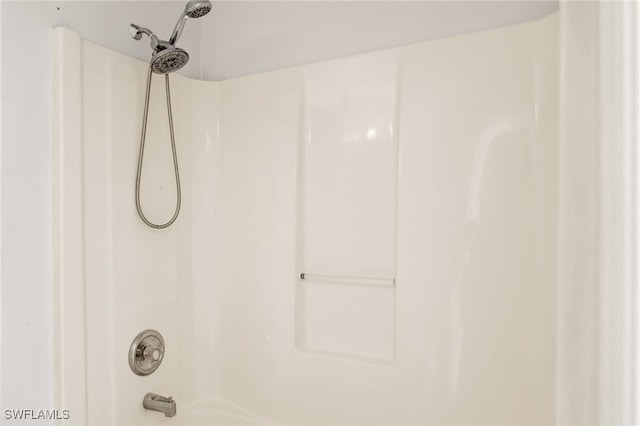 interior details with tub / shower combination